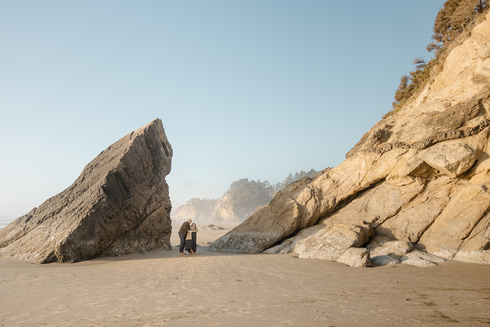 couple walks at hug point