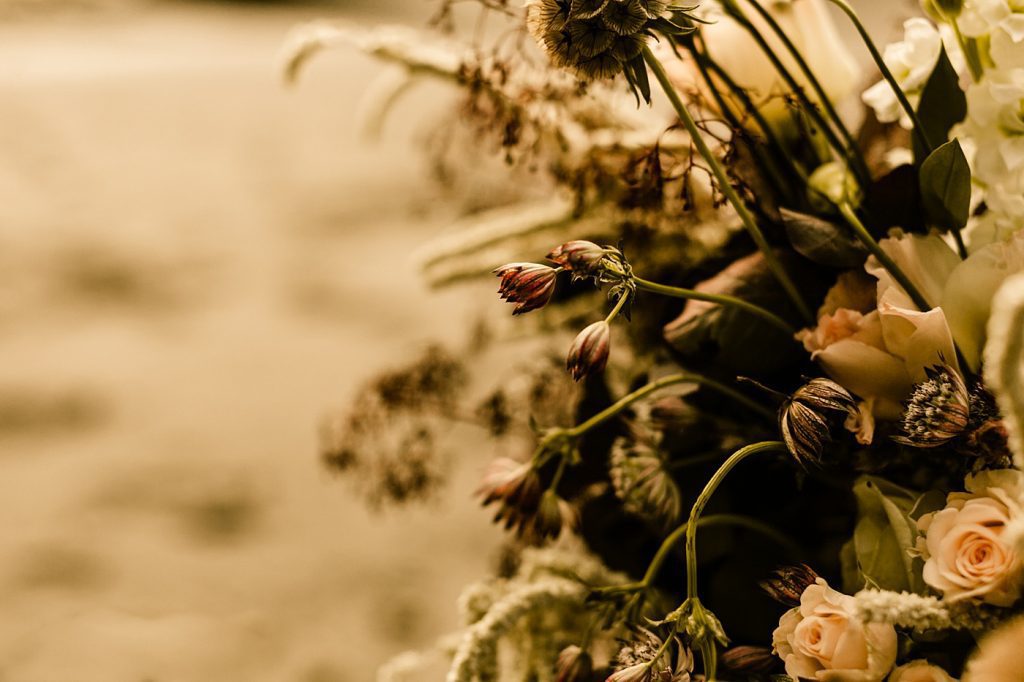 Wildflower florals for intimate beach ceremony
