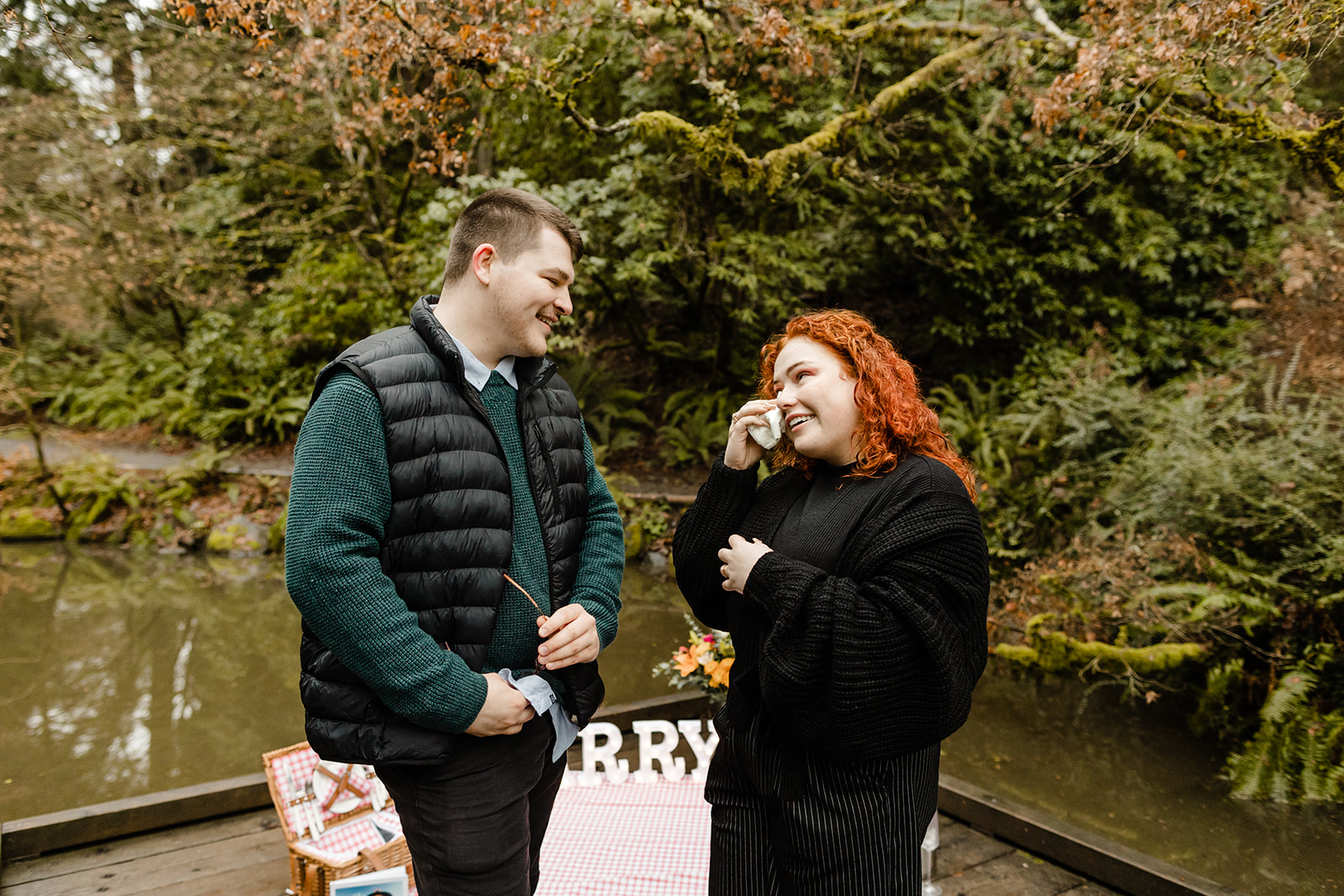 couple wiping tears after new engagement seattle proposal photographer