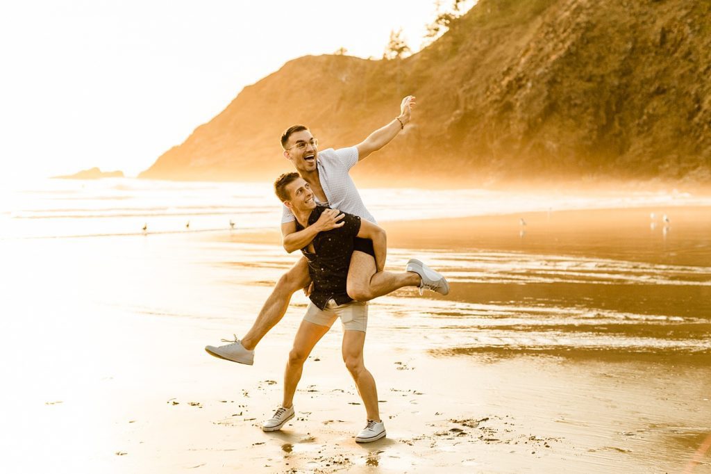pose ideas with two grooms piggy back ride at sunset, fun and candid photo ideas
