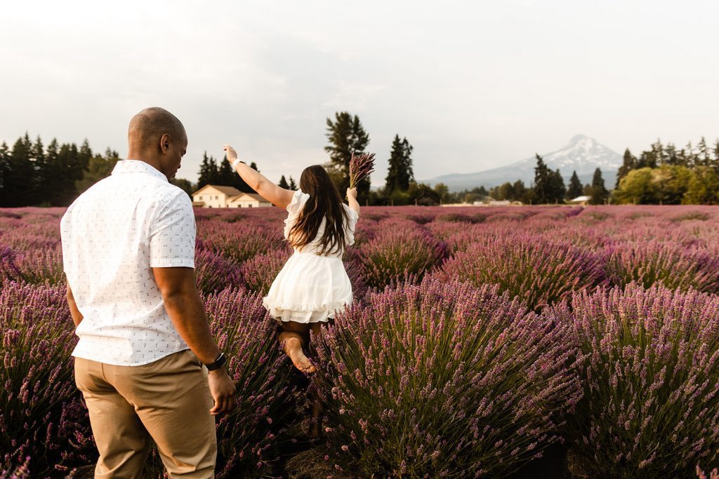 lavender field engagement photo session frolicking in the field of flowers, wearing white and khakis, What to wear for my engagement session