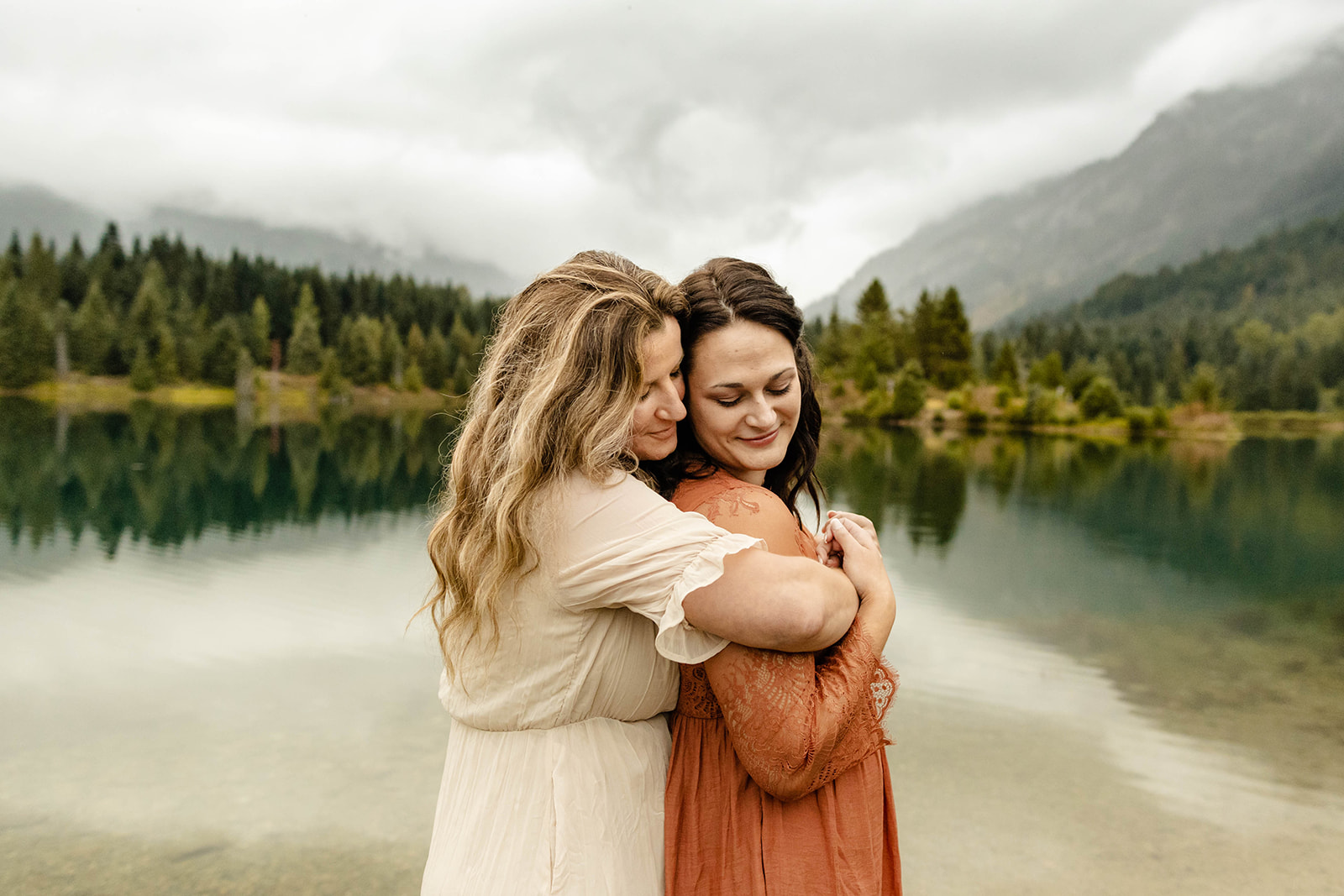 couple cuddling/hugging during their fall engagement photos session