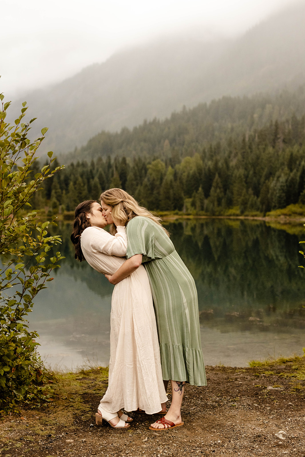 couple leans in for a kiss at their fall engagement photos session