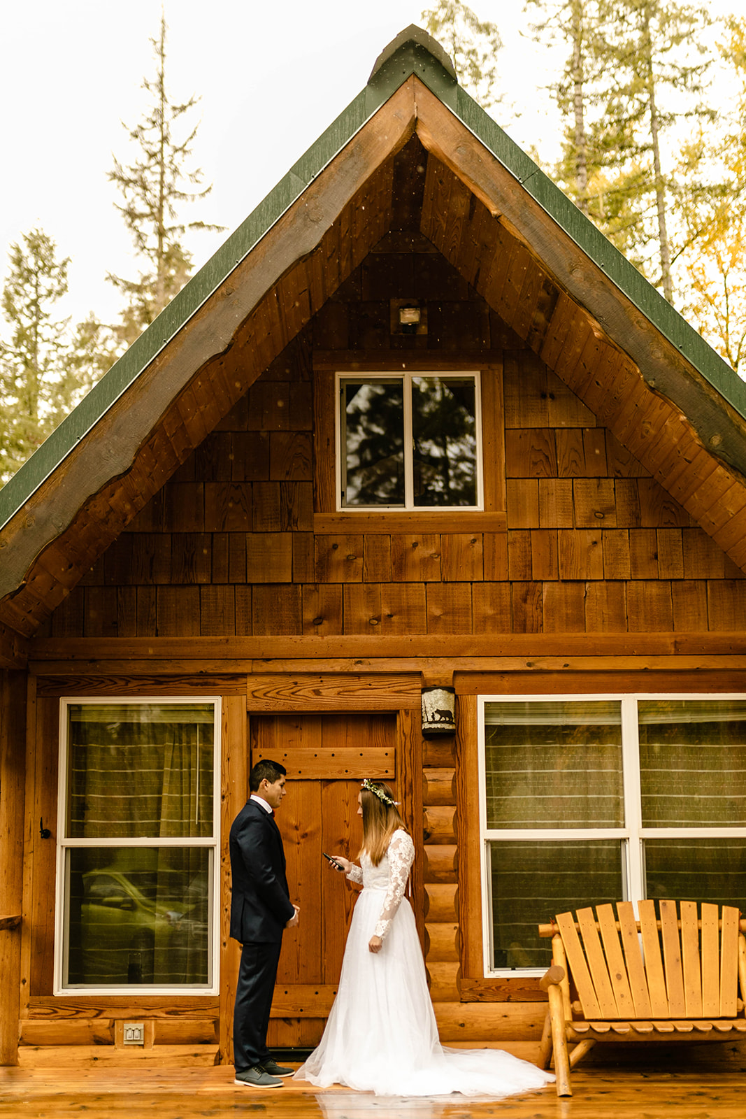 Couple exchanges vows on the porch of a cabin.
