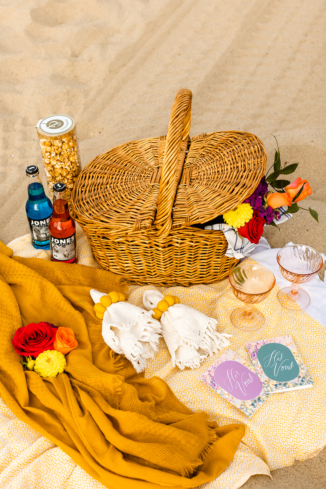 wedding picnic items laid out on the sand at Santa Monica.