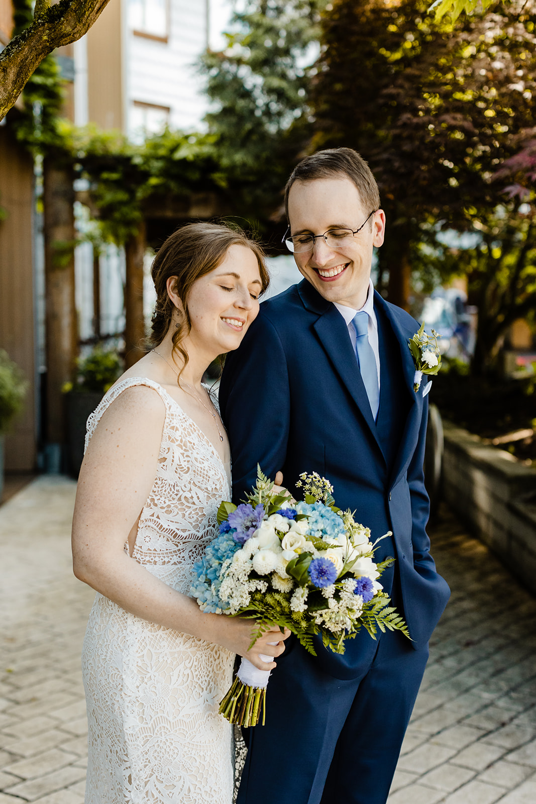 bride rests her head on groom's shoulder.