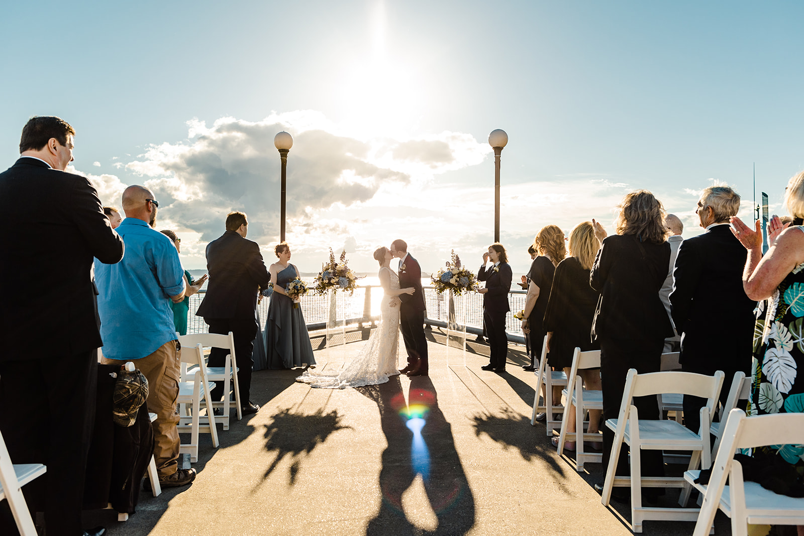 couple kisses after wedding ceremony at the seattle aquarium.