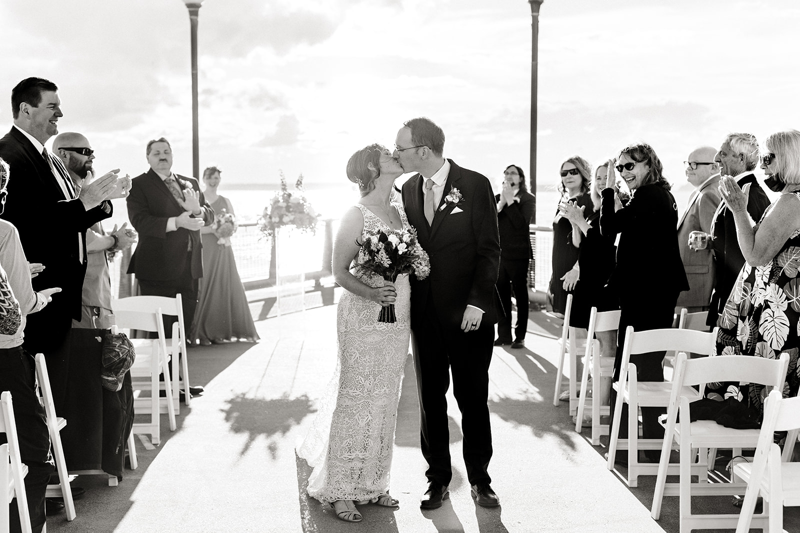 couple kisses after wedding ceremony at the seattle aquarium.