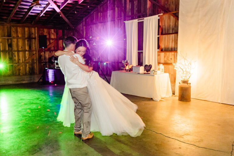 groom swings bride around on dance floor at Maplehurst Farm wedding, non-traditional first dance songs