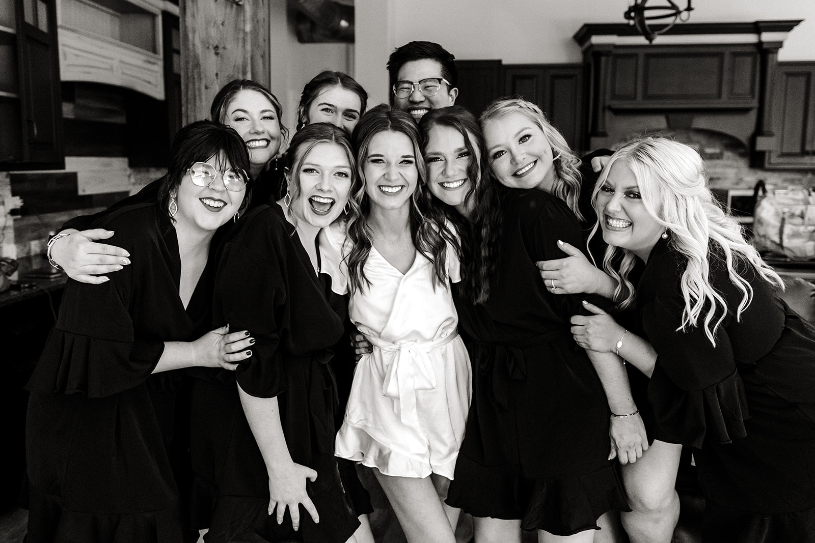 bride and her girls gather together smiling