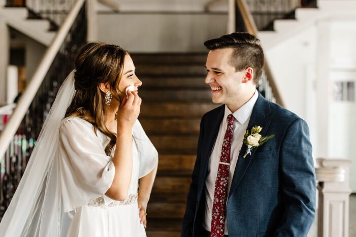 bride and groom read vows during classic wedding photography