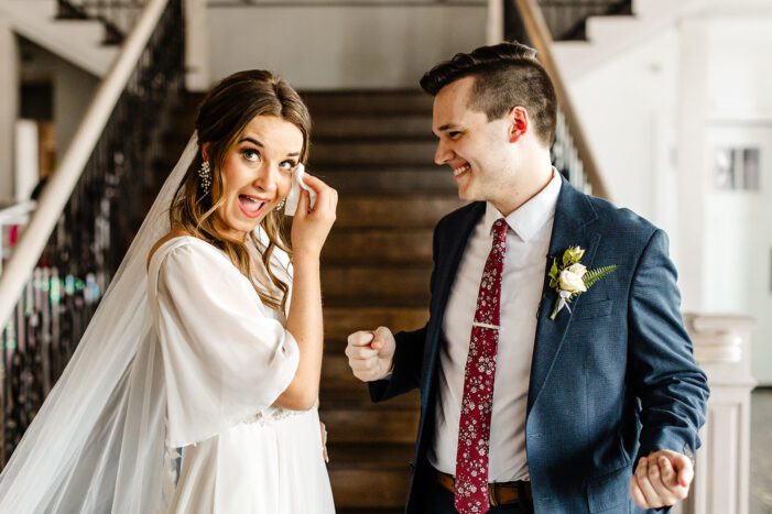 bride and groom read vows during classic wedding photography