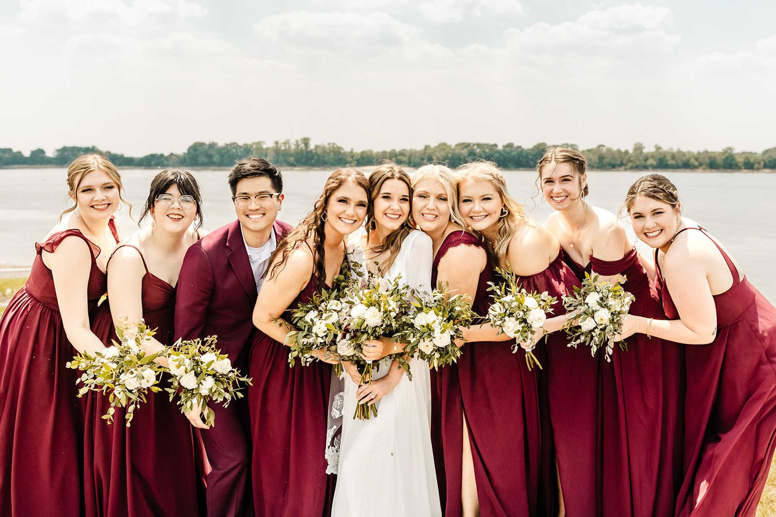 bride snuggles with her bridal party