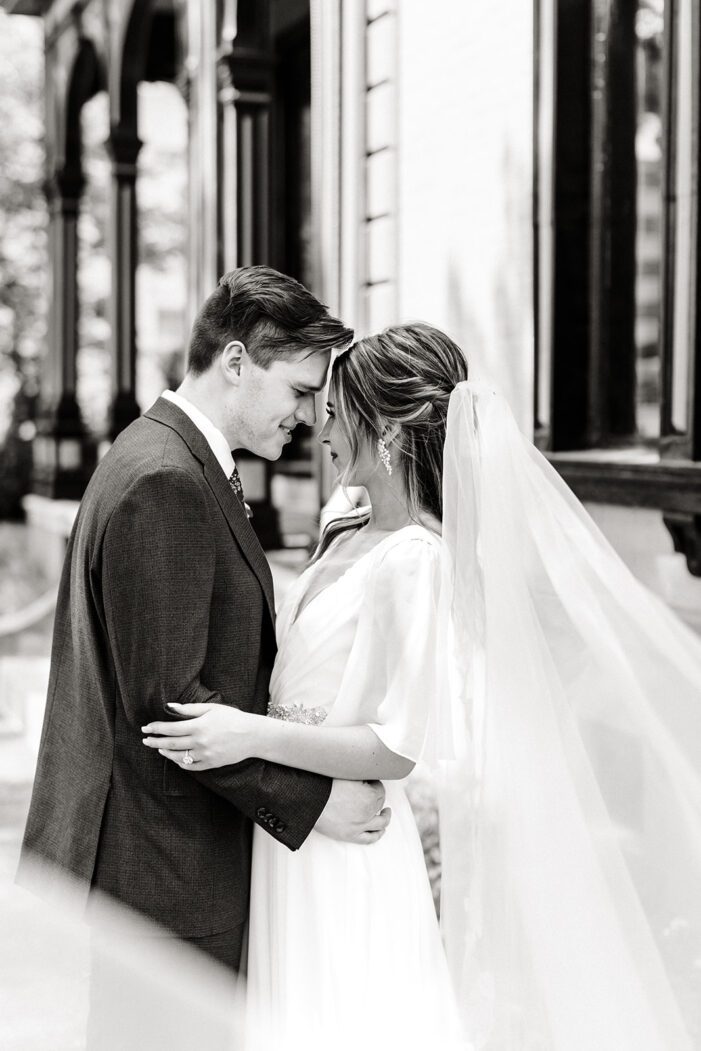 bride and groom snuggle together