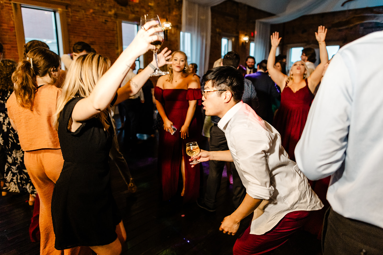 wedding guests dance at reception