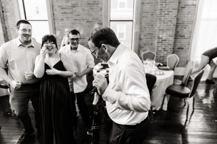 wedding guests dance at reception