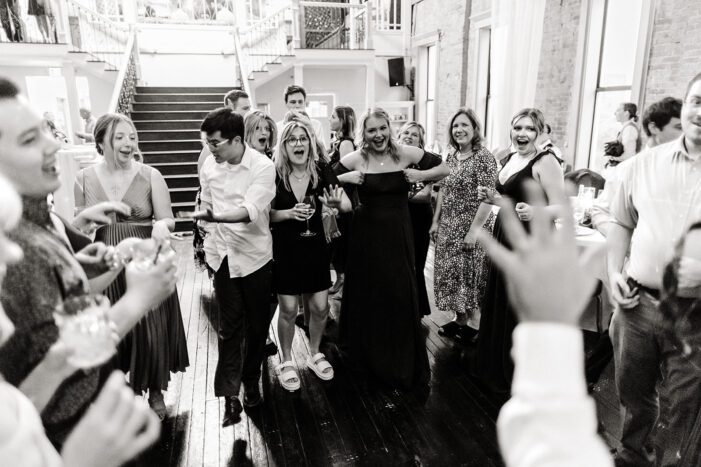 wedding guests dance at reception
