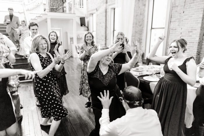 wedding guests dance at reception