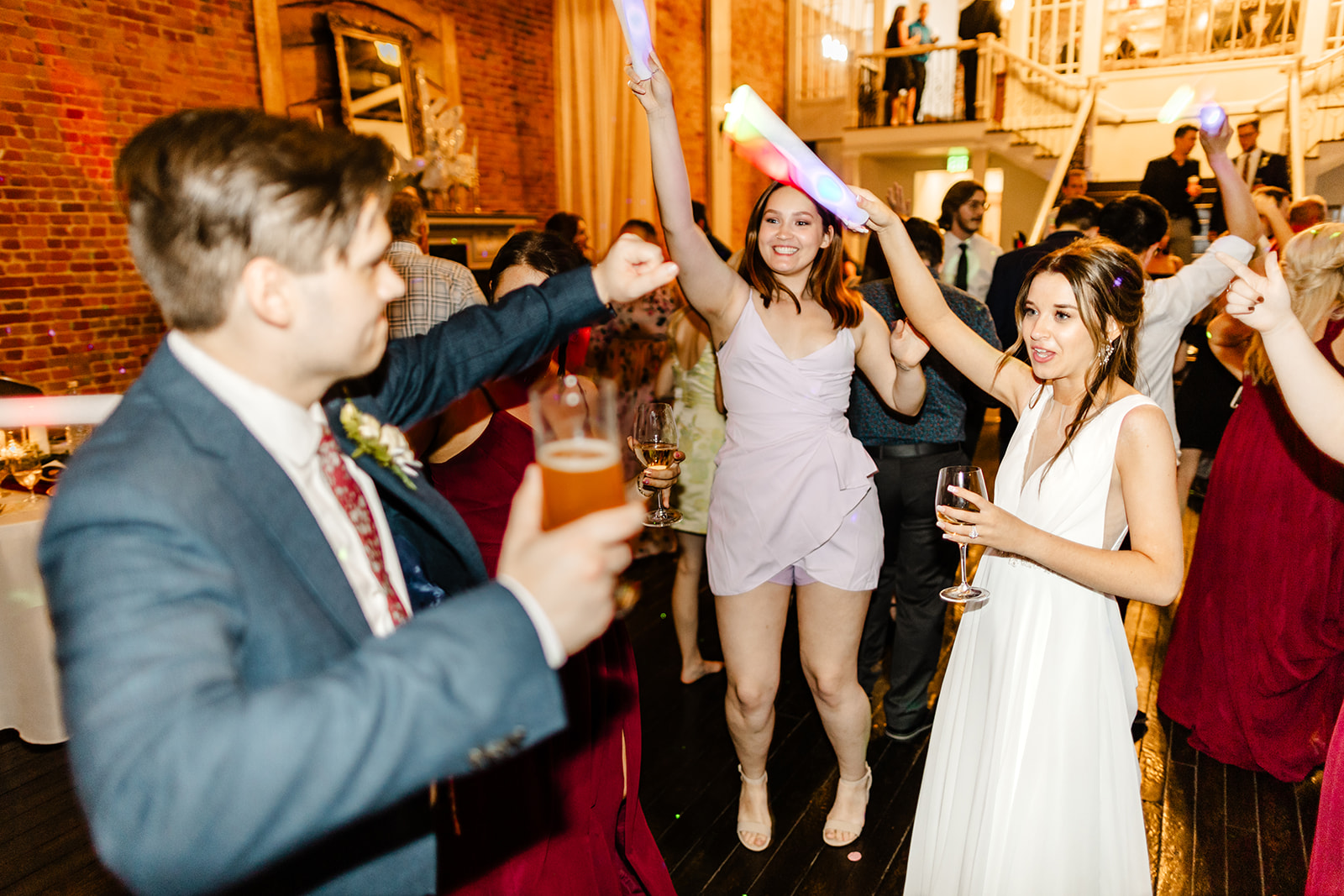 wedding guests dance at reception