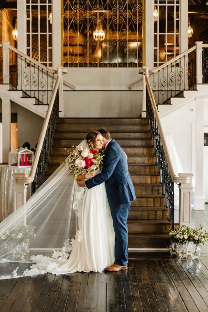 bride and dad embrace during classic wedding photography