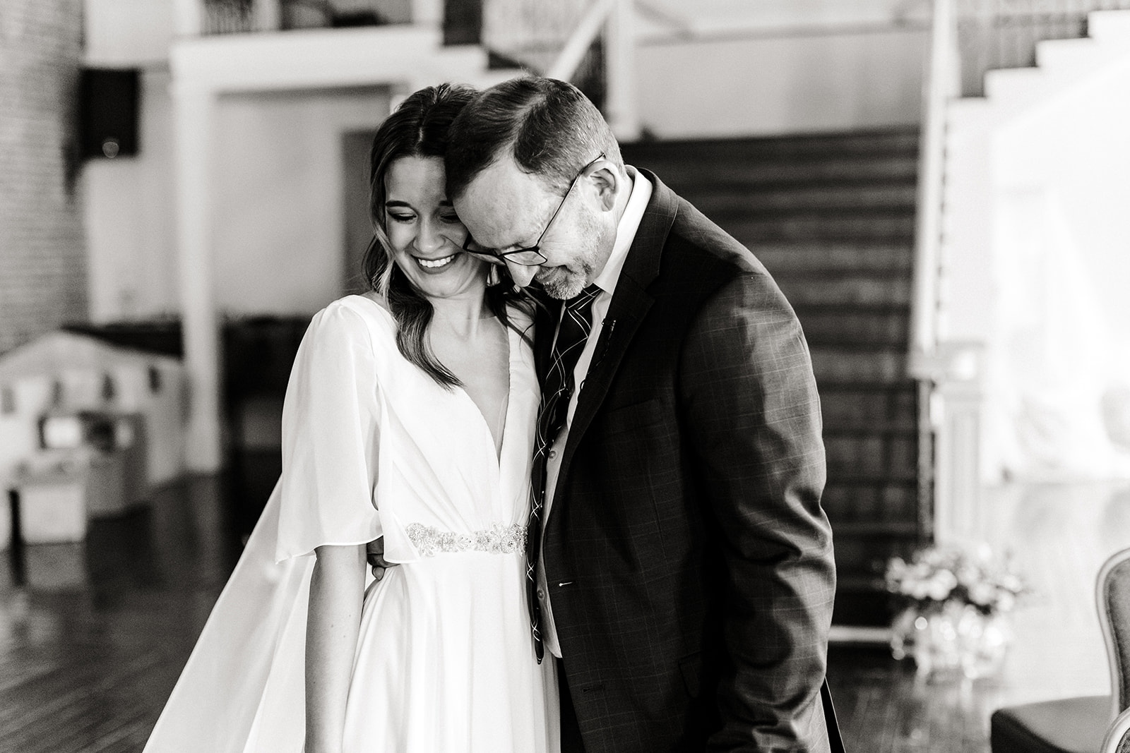 bride and dad hug during first look