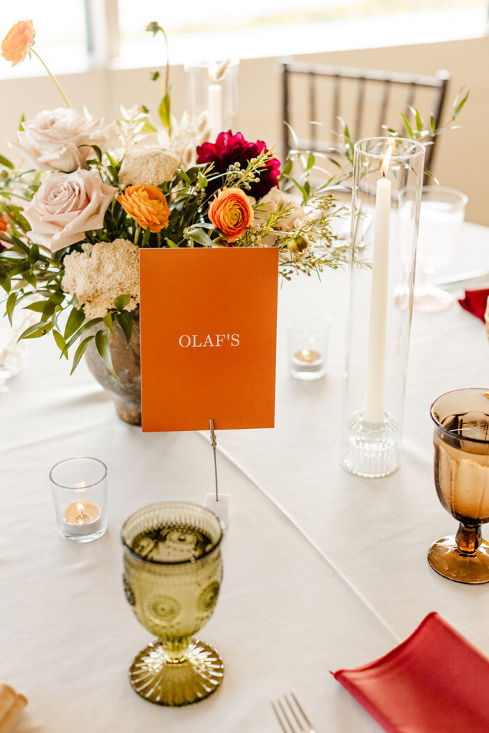 red, orange, and white wedding reception details