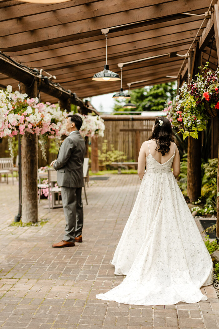 bride approaches man from behind