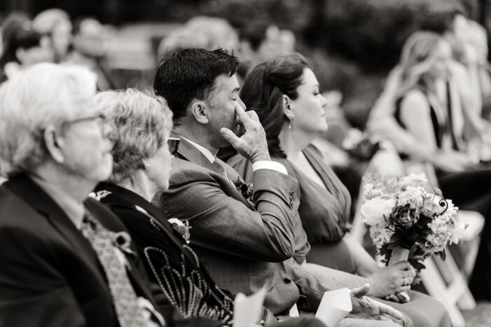 older man wipes away tears during kiana lodge wedding