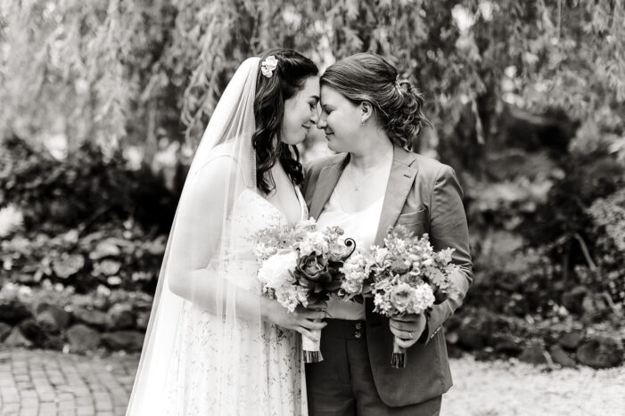 two brides face each other