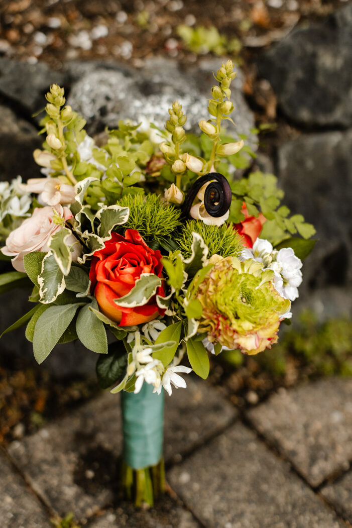 wedding bouquet leans against wall