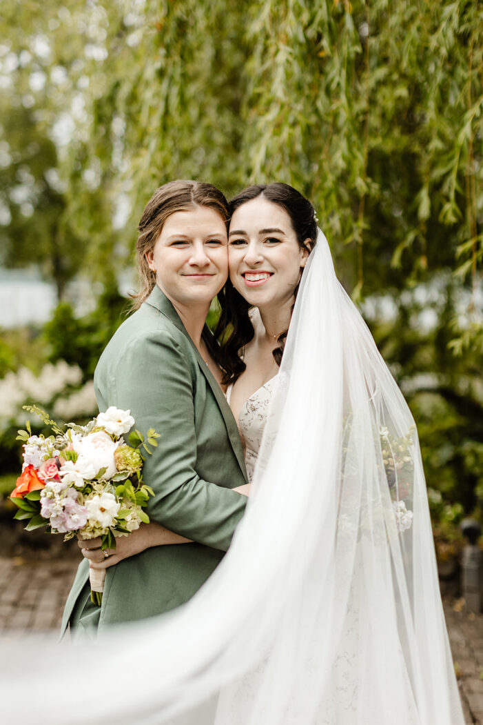 two brides smile at camera