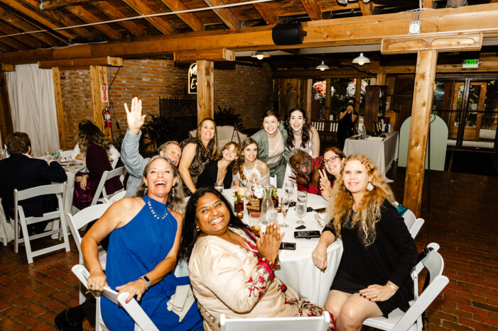 guests smile while watching dance