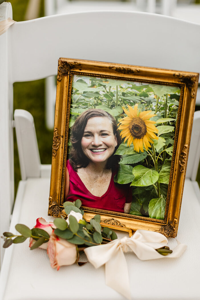 womans pictures on chair at wedding ceremony