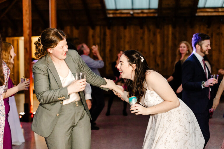 brides dance with guests at wedding