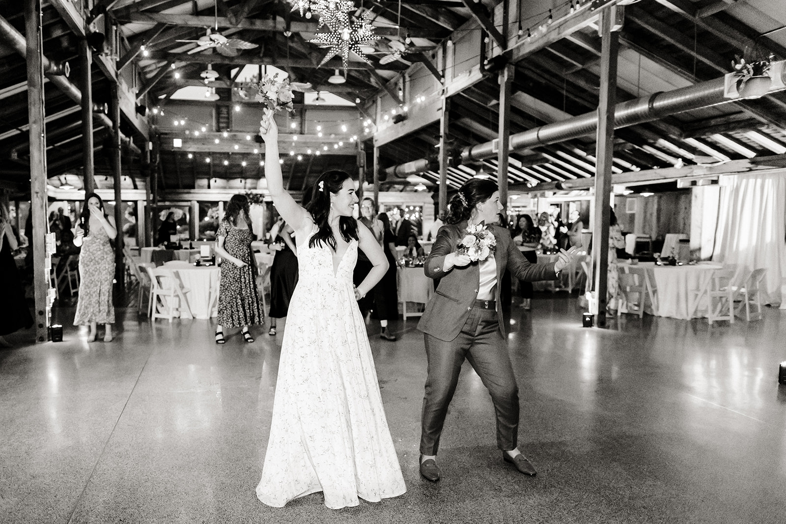brides dance with guests at wedding