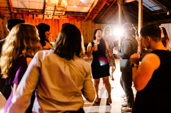 brides dance with guests at wedding