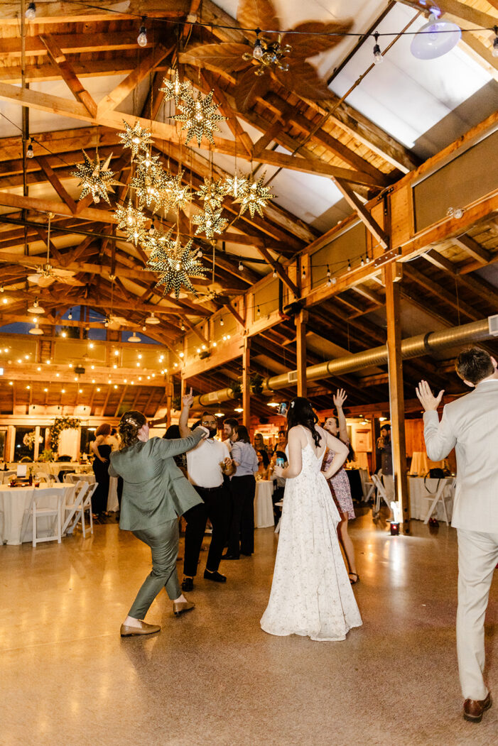 brides dance with guests at wedding