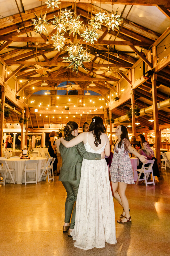 brides dance with guests at wedding