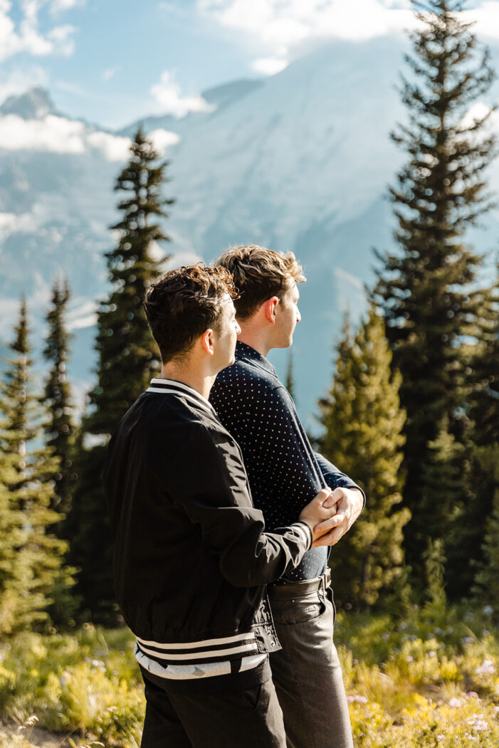 two boys stare out at the mountains