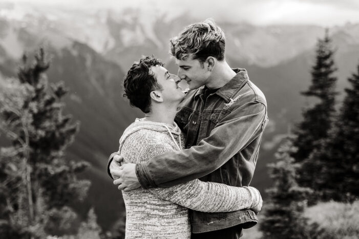 two boys hug during mt rainier engagement session