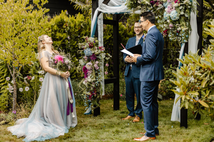 bride throws back her head and laughs
