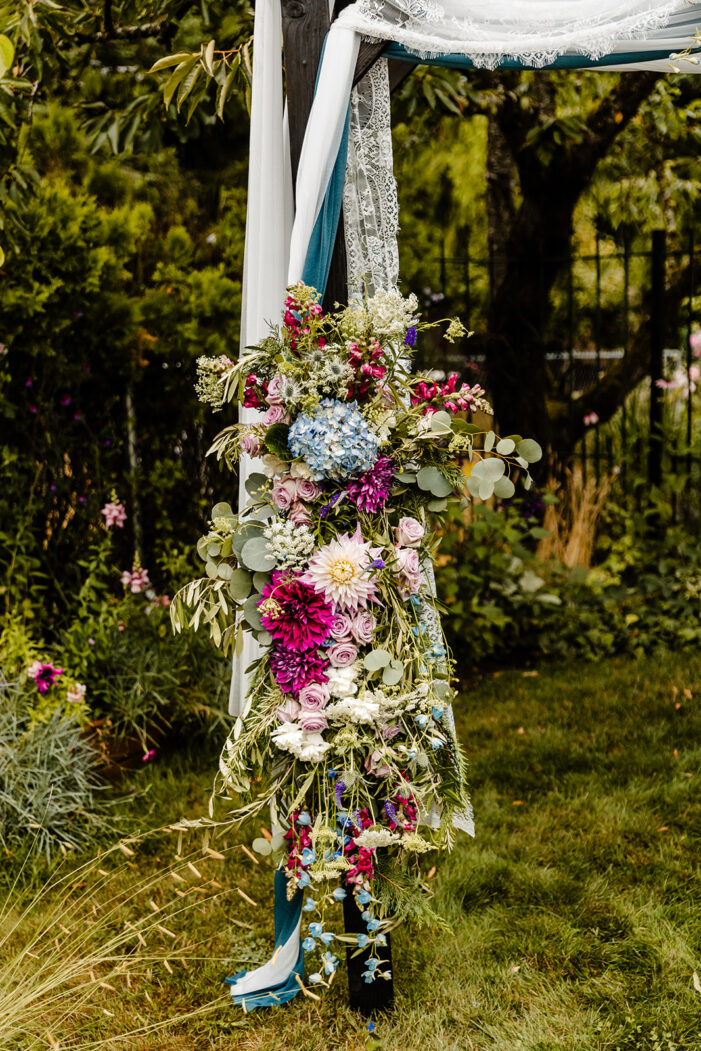 ceremony florals on arch