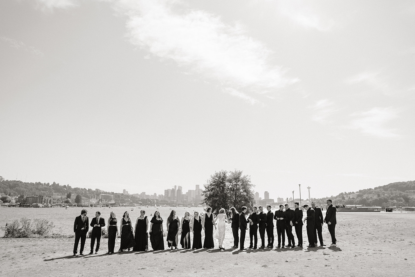 bridal party poses together in a long line