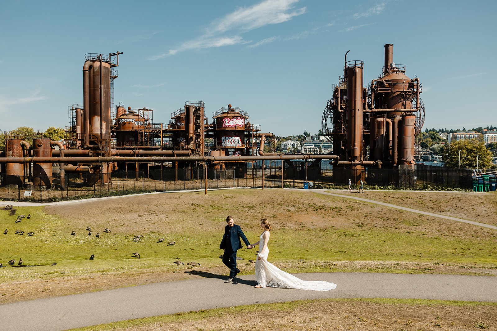 bride and groom walk in gas works park
