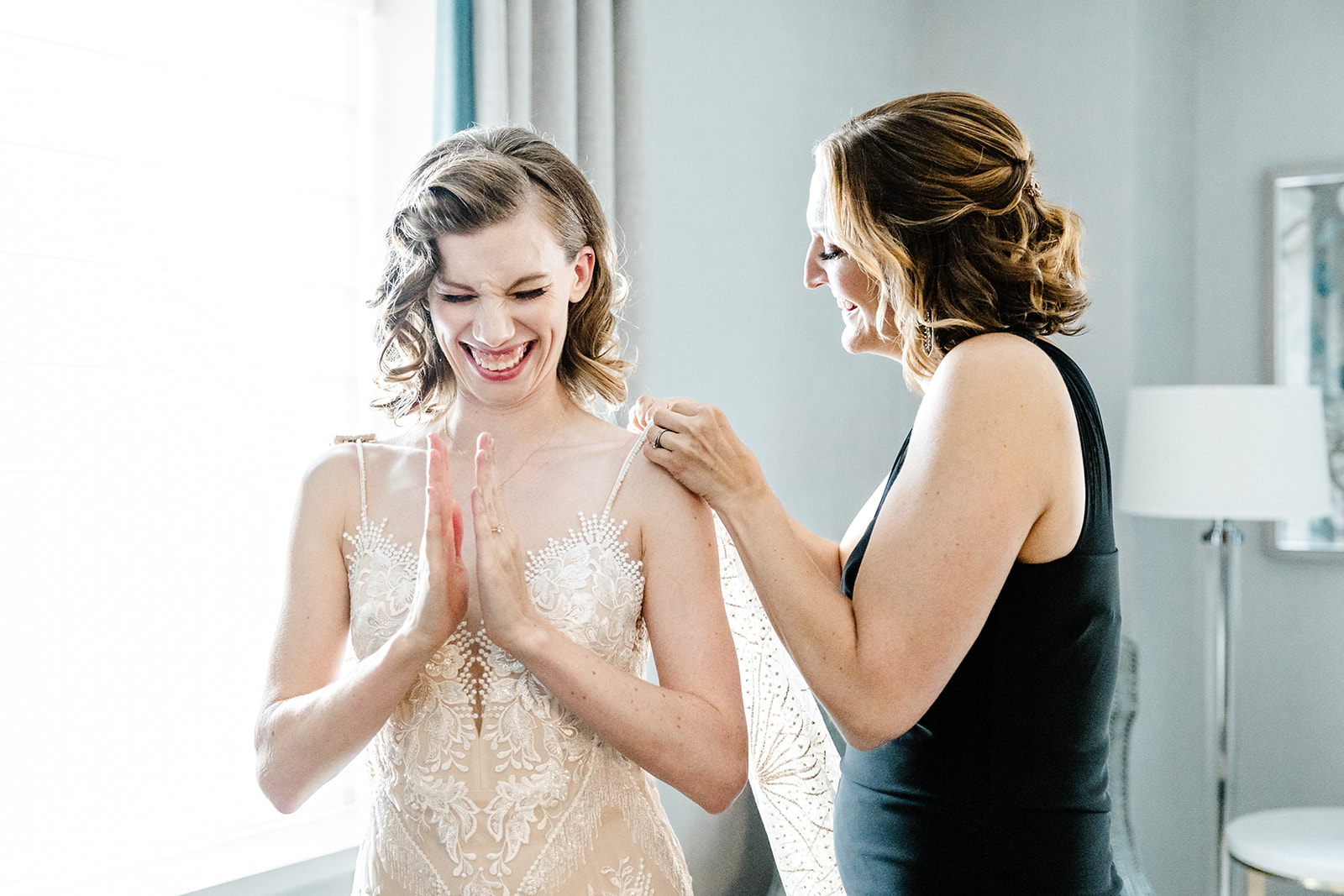 bride smiles and claps