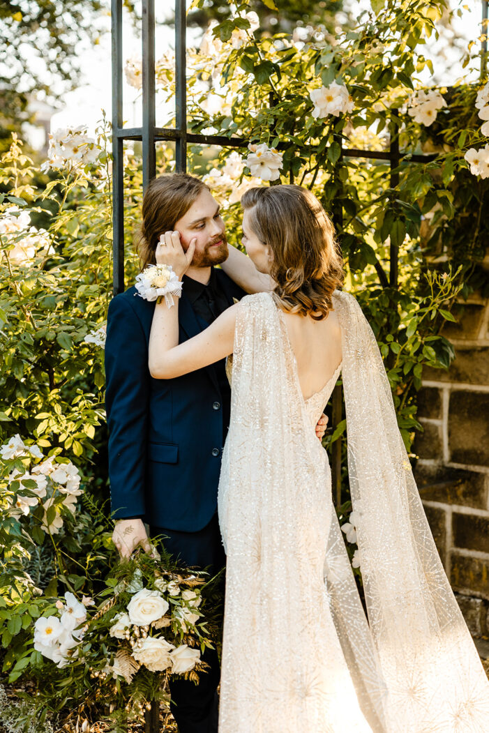 bride touches grooms face 