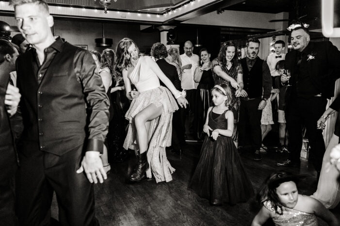 bride dances amongst wedding guests