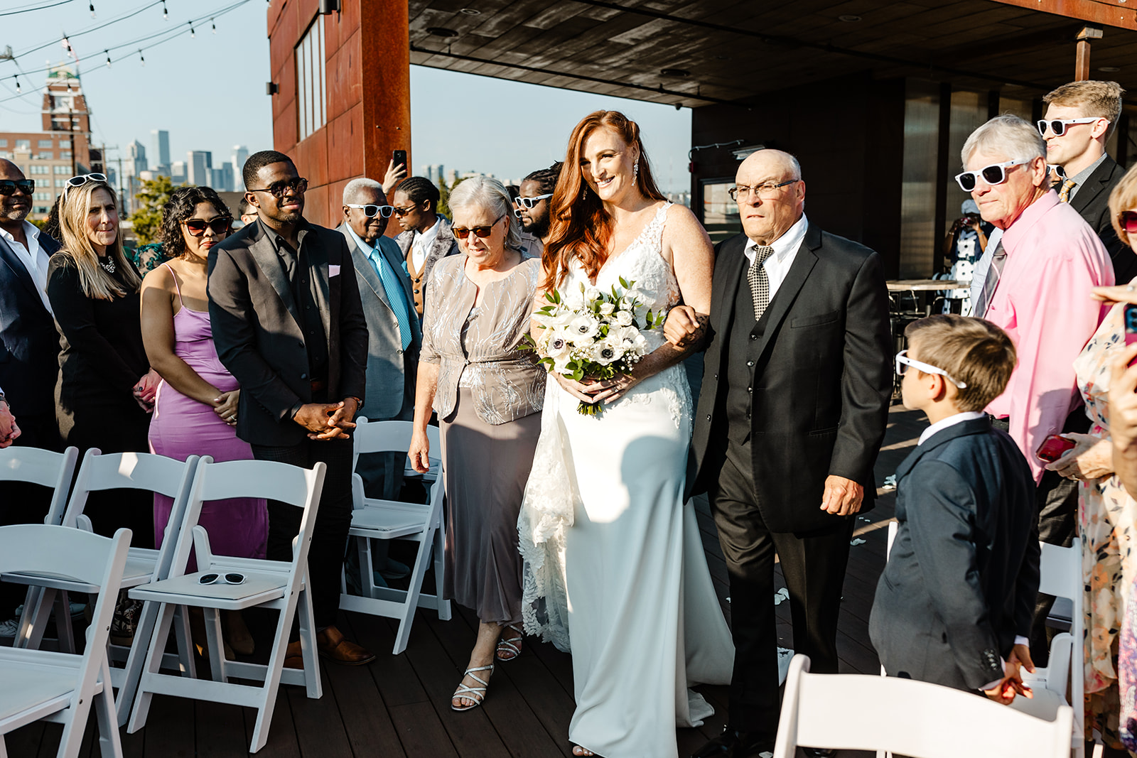 bride walks down aisle at within sodo wedding venue