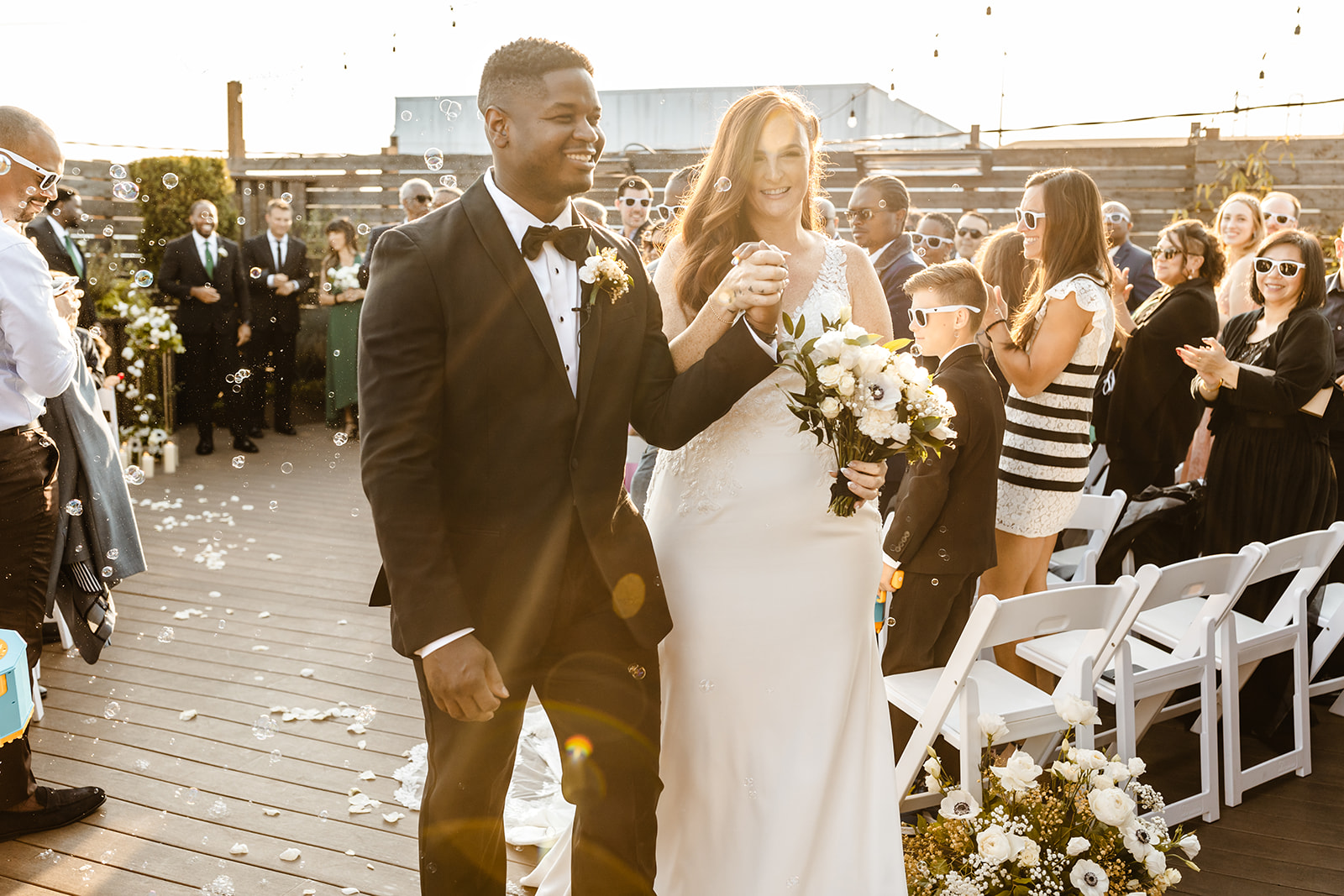 bride and groom walk up aisle at Within Sodo wedding venue