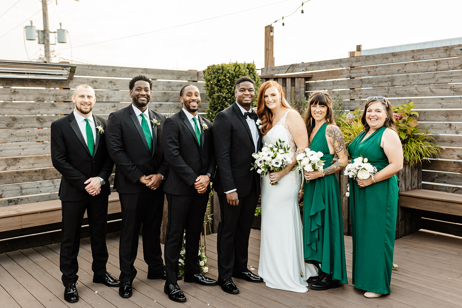 bridal party in green at Within Sodo wedding venue